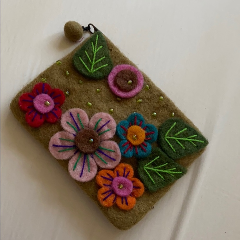 Handcrafted felt coin purse with flower ap…